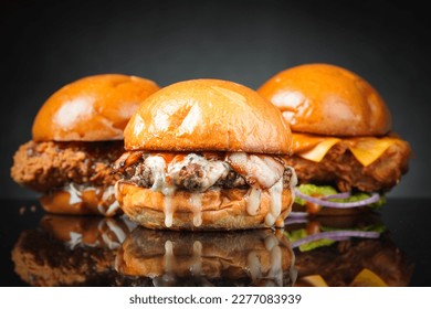 Homemade burgers on dark background. - Shutterstock ID 2277083939