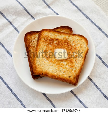 Similar – Image, Stock Photo Toasted toast bread in toaster on pink background