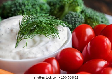 Homemade Buttermilk Ranch Salad Dressing With Dill Served With Cherry Tomatoes, Baby Carrots And Broccoli, Over A Rustic Wooden Background.