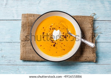 Homemade butternut squash and chilli soup. Served with a dollop of creme fraiche, seasoned with chilli flakes and black pepper