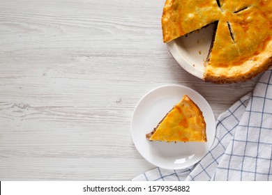 Homemade Canadian Tourtiere(Holiday Meat Pie) On A White Wooden Background, Top View. Flat Lay, Overhead, From Above. Copy Space.