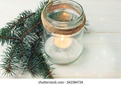 Homemade Candle Holder - Candle In Mason Jar With Twine And Pine Boughs. Soft Light And Focus. Toned.