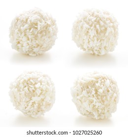 Homemade candy white chocolate and coconut on a plate on white isolated background. Set Candy  truffles snowball. Selective focus