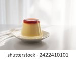 Homemade caramel custard pudding in an upside down glass on a plate, how to unmold caramel pudding.