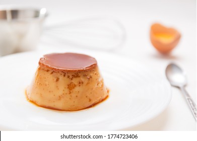 Homemade Crème Caramel With Eggs On White Background