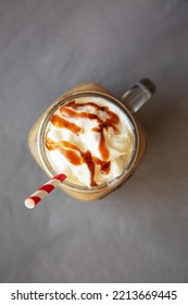  Homemade Caramel Iced Latte With Whipped Cream In A Glass Jar, Top View. Flat Lay, Overhead, From Above. 