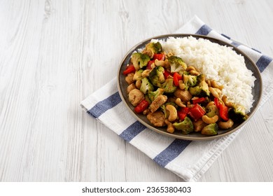 Homemade Cashew Chicken Stir-Fry on a Plate, side view. Copy space. - Shutterstock ID 2365380403