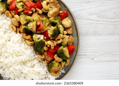 Homemade Cashew Chicken Stir-Fry on a Plate, top view. Flat lay, overhead, from above. Copy space. - Shutterstock ID 2365380409