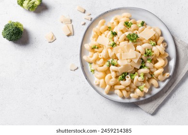 Homemade Cavatappi Alfredo Pasta with Broccoli on white background, top view, copy space. Creamy vegan  pasta with broccoli and parmesan cheese. - Powered by Shutterstock