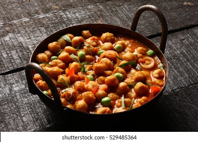 Homemade Chana Masala Served In Cast Iron Cookware, 