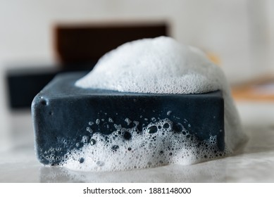 Homemade Charcoal Soap Covered In Sudsy Bubbles