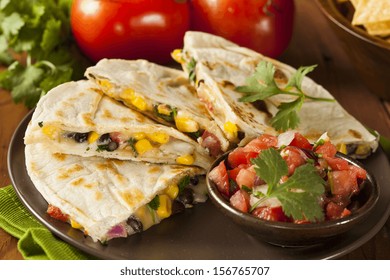 Homemade Cheese And Bean Quesadilla With Corn And Salsa