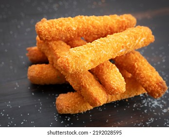 Homemade Cheese Bread Sticks On A Wooden Background.