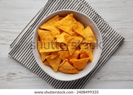 Homemade Cheese Tortilla Chips in a Bowl, top view. Flat lay, overhead, from above.