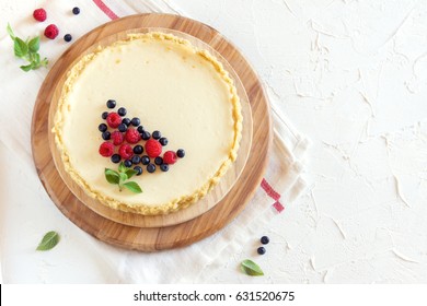 Homemade Cheesecake With Fresh Berries And Mint For Dessert - Healthy Organic Summer Dessert Pie Cheesecake. Cheese Cake.