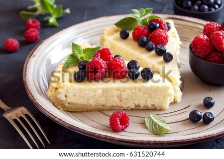 Homemade cheesecake with fresh berries and mint for dessert - healthy organic summer dessert pie cheesecake. Cheese cake.
