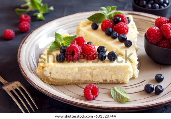 Homemade cheesecake with fresh berries and mint for\
dessert - healthy organic summer dessert pie cheesecake. Cheese\
cake.