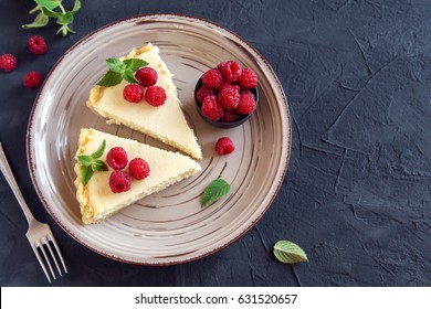 Homemade cheesecake with fresh raspberries and mint for dessert - healthy organic summer dessert pie cheesecake. Vanilla Cheese Cake.