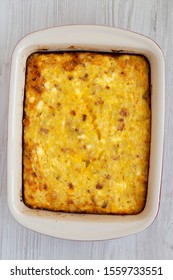 Homemade Cheesy Amish Breakfast Casserole On A White Wooden Background, Top View. Flat Lay, Overhead, From Above. Close-up.