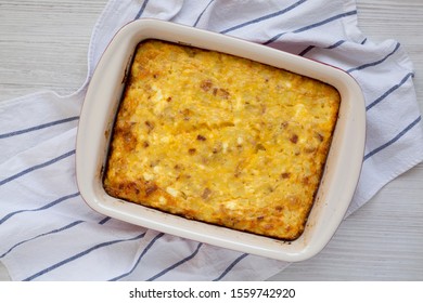 Homemade Cheesy Amish Breakfast Casserole On A White Wooden Background, Overhead View. Flat Lay, Top View, From Above. Close-up.