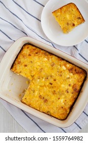 Homemade Cheesy Amish Breakfast Casserole On A White Wooden Surface, Top View. Flat Lay, Overhead, From Above. 