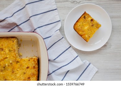 Homemade Cheesy Amish Breakfast Casserole On A White Wooden Background, Top View. Flat Lay, Overhead, From Above. 