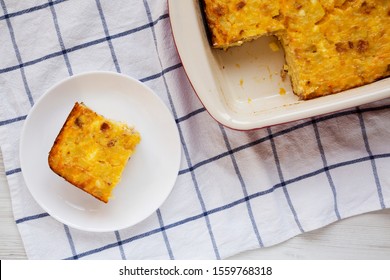 Homemade Cheesy Amish Breakfast Casserole On A White Wooden Table, Top View. Flat Lay, Overhead, From Above. 