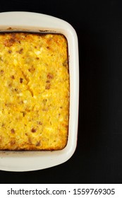 Homemade Cheesy Amish Breakfast Casserole On A Black Surface, Top View. Flat Lay, Overhead, From Above. Copy Space.