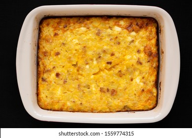 Homemade Cheesy Amish Breakfast Casserole On A Black Background, Overhead View. Flat Lay, From Above, Top View. Close-up.