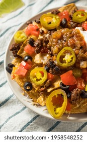 Homemade Cheesy Beef Nachos with Olives and Jalapenos