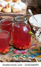 Homemade cherry compote in a jar.