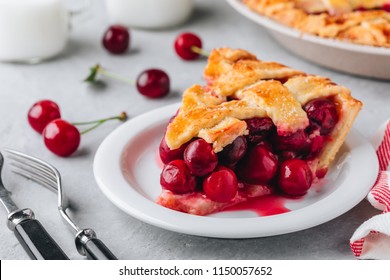 Homemade Cherry Pie with a Flaky Crust on Grey stone background. 