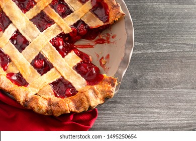 A Homemade Cherry Pie on a Wooden Table