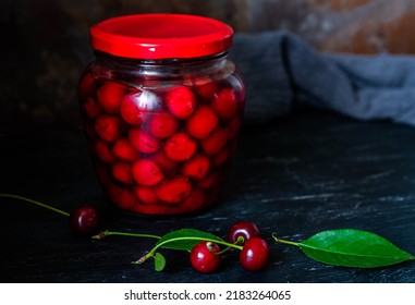 Homemade Cherry Preserves. Fresh Pitted Cherries In Sugar Syrup In A Glass Jar. Canned Organic Food From The Garden.