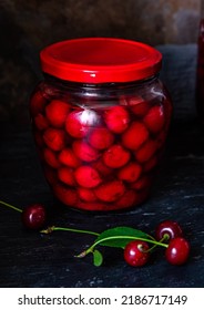 Homemade Cherry Preserves. Fresh Pitted Cherries In Sugar Syrup In A Glass Jar. Canned Organic Food From The Garden.