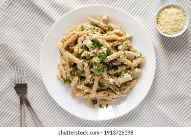 Homemade Chicken Alfredo Penne With Parsley On Cloth, Top View. Overhead, From Above, Flat Lay. 