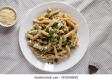 Homemade Chicken Alfredo Penne With Parsley On A White Plate, Top View. Overhead, From Above, Flat Lay. 