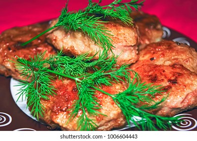 Homemade chicken cutlets and fresh greens. - Shutterstock ID 1006604443
