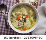 Homemade chicken dumpling soup in a bowl
