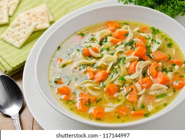 Homemade Chicken Noodle Soup With Crackers.