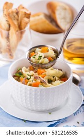 Homemade Chicken Noodle Soup With Vegetables. Selective Focus On Soup In Ladle