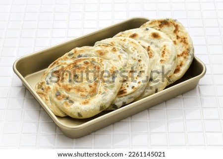 Homemade Chinese green onion pancakes. The inside is layered.