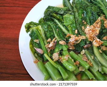 Homemade Chinese Kale with Oyster Sauce in closeup view - Shutterstock ID 2171397559