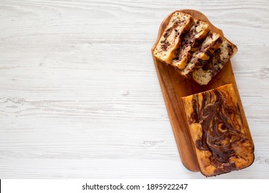 Homemade Chocolate Banana Bread On A Rustic Wooden Board, Top View. Flat Lay, Overhead, From Above. Copy Space.