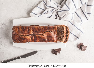 Homemade chocolate bread (cake) for tea on a white background, top view. - Shutterstock ID 1196494780