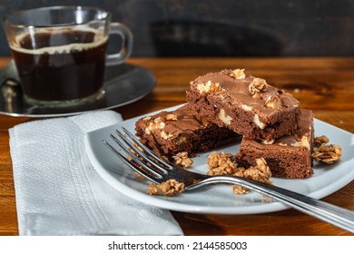 Homemade Chocolate Brownie Squares With Pecan Pieces Served On A White Plate. Natural, Healthy Food Concept. High View.