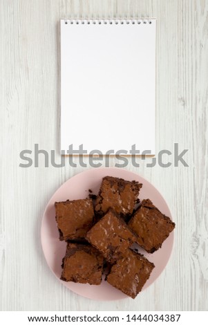 Similar – Image, Stock Photo Pink chocolate brownie in a tray on white table