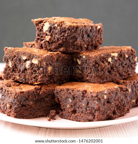 Similar – Image, Stock Photo Pink chocolate brownie in a tray on white table