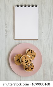 Homemade Chocolate Chip Cookie Ice Cream Sandwich On A Pink Plate On A White Wooden Table, Top View. Overhead, From Above, Flat Lay. 