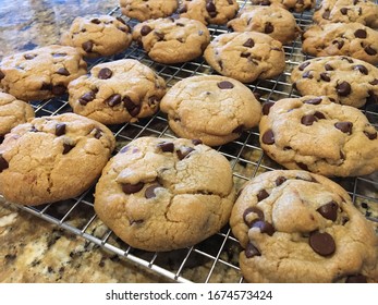 Homemade Chocolate Chip Cookies on a Cooling Rack on a Granite Counter 